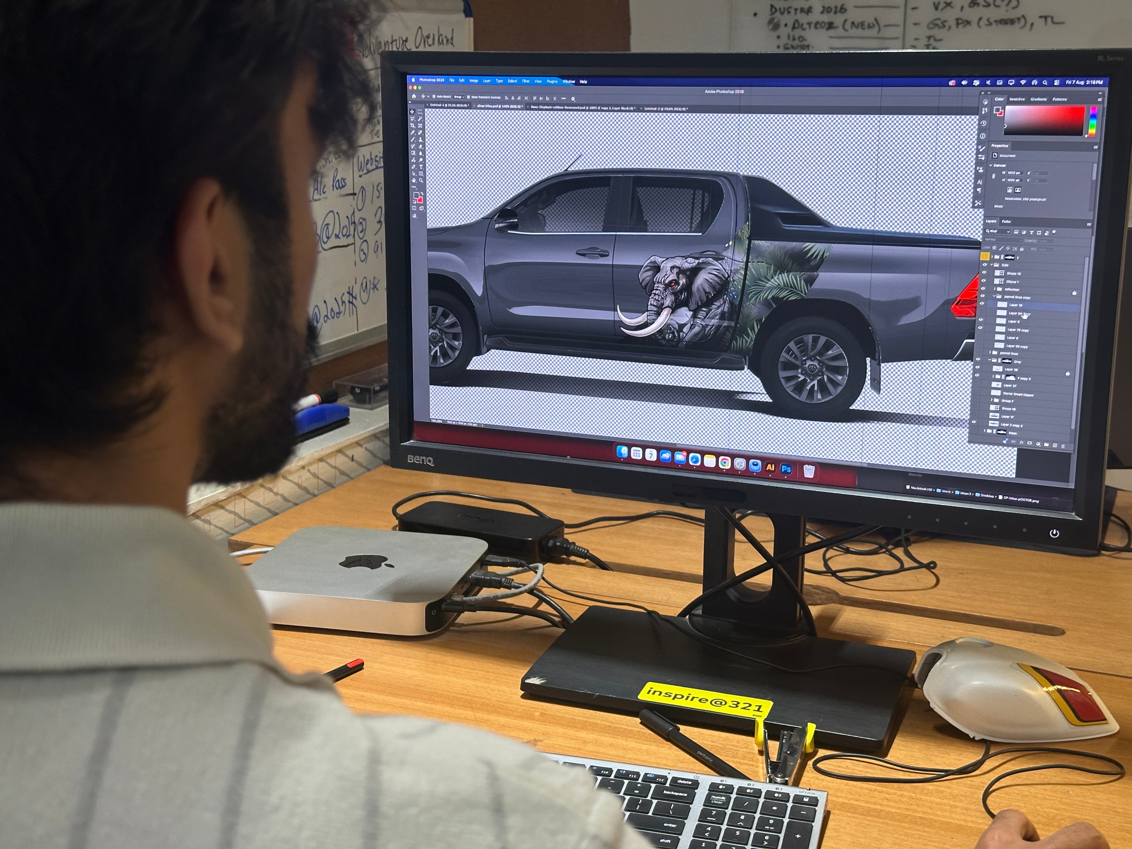 An IDE designer working on a vehicle wrap graphic in Photoshop