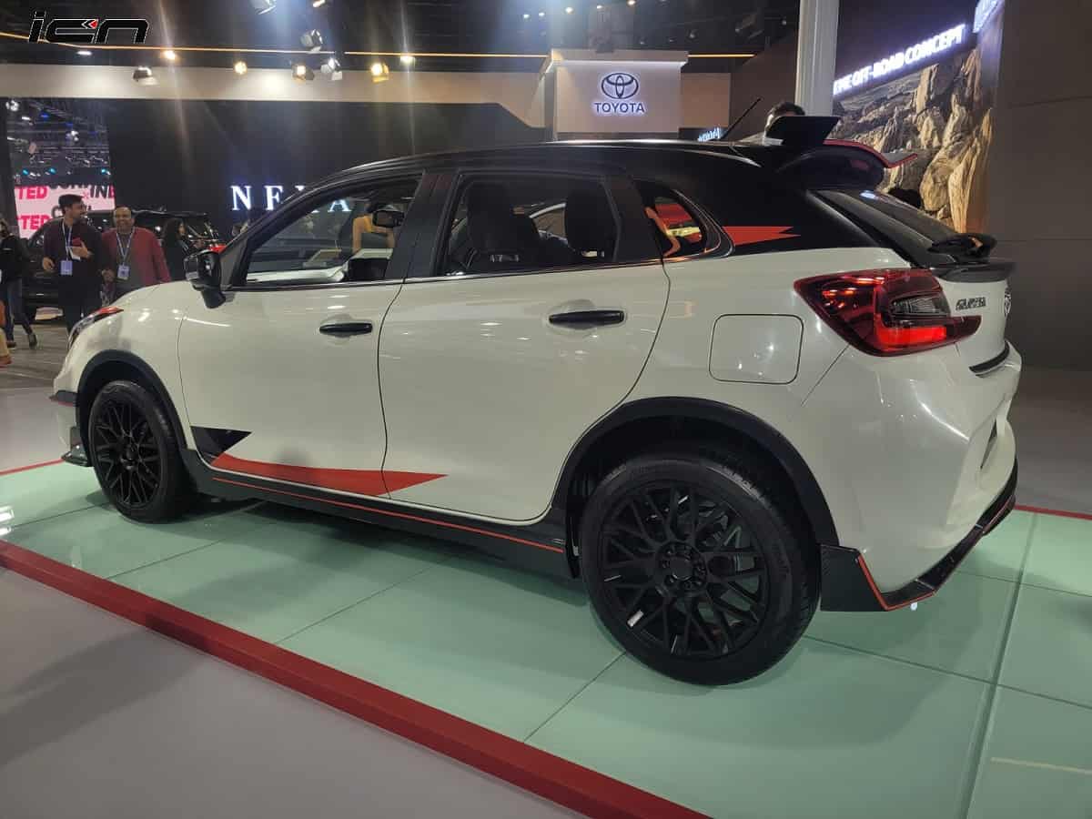 Toyota Glanza with a GR-inspired black roof and red graphic livery, on display at Auto Expo 2023
