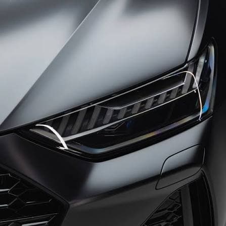 Matte paint protection film on a car's headlight and hood